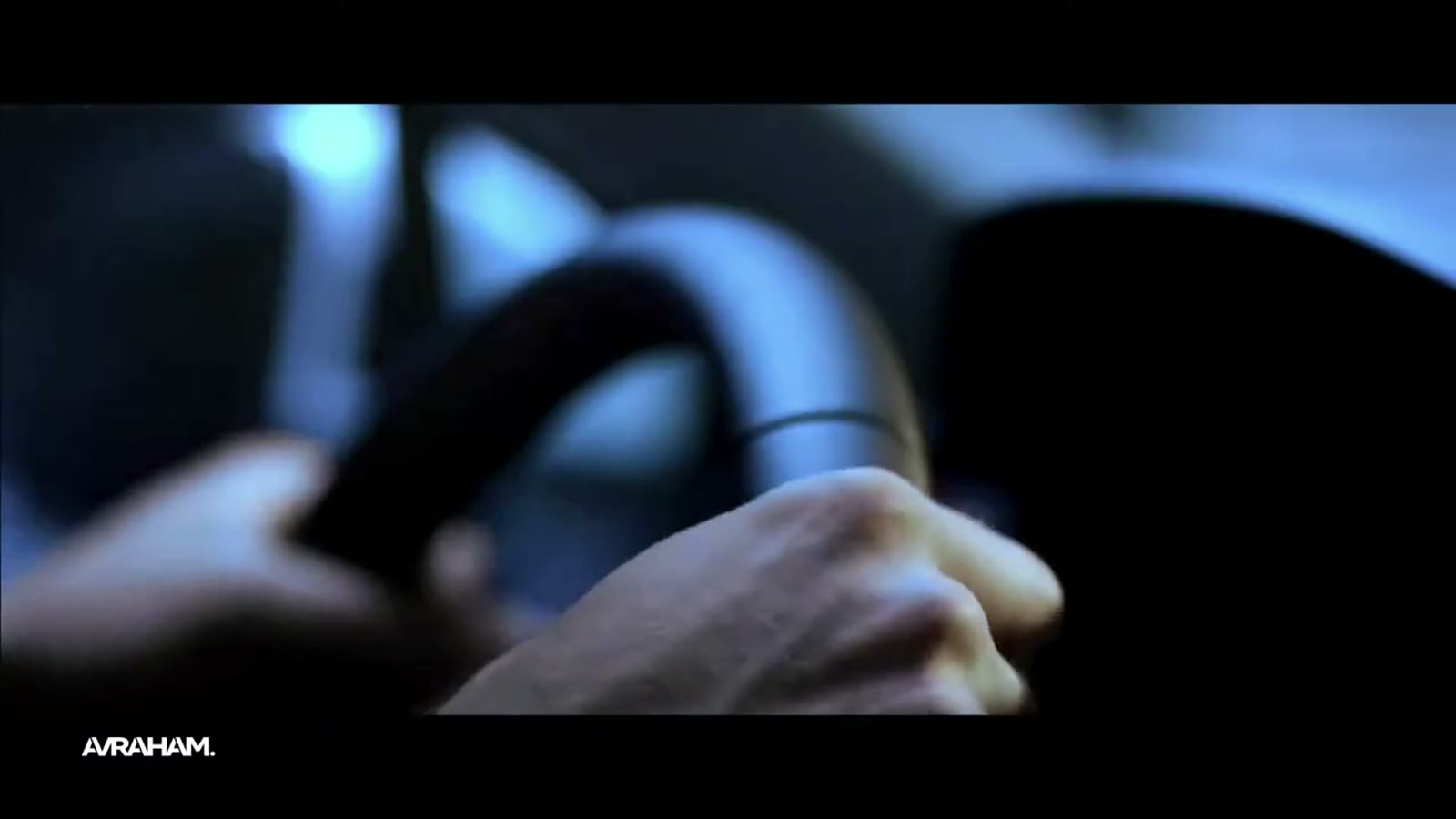 Volkswagen film, hands on the steering wheel.